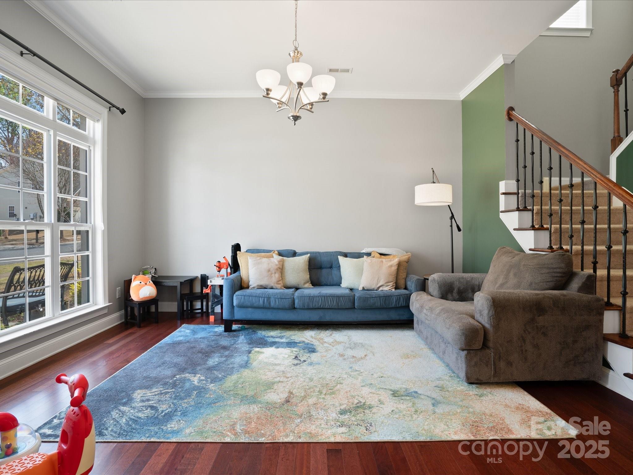 567 Quicksilver Trail Fort Mill, SC 29708 - Photo 3 of 37 a living room with furniture and a chandelier
