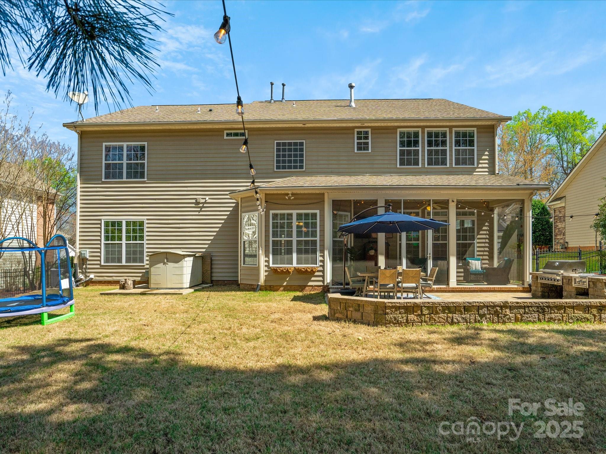 567 Quicksilver Trail Fort Mill, SC 29708 - Photo 33 of 37 a front view of a house with a yard fire pit and outdoor seating