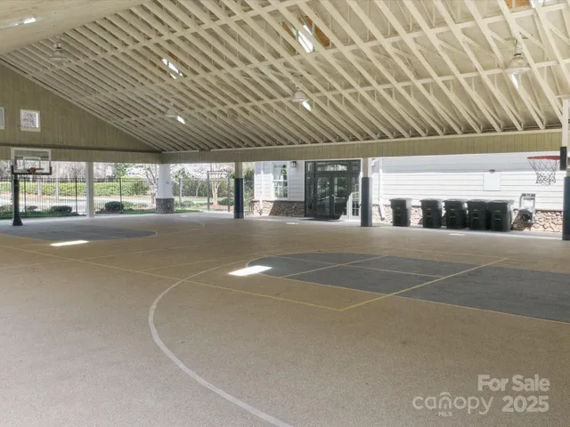 an entryway and livingroom with furniture wooden floor and windows