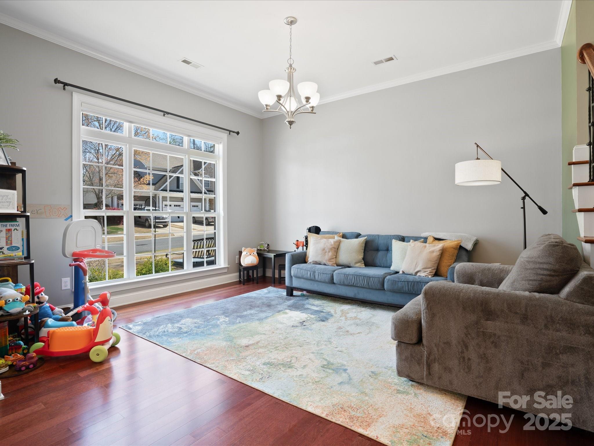 567 Quicksilver Trail Fort Mill, SC 29708 - Photo 9 of 37 a living room with furniture and a large window