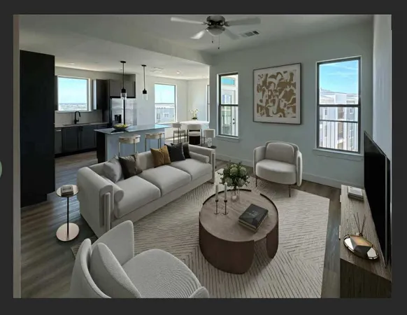 a living room with furniture rug and window