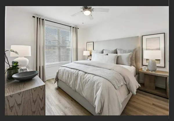 a bedroom with a bed and window