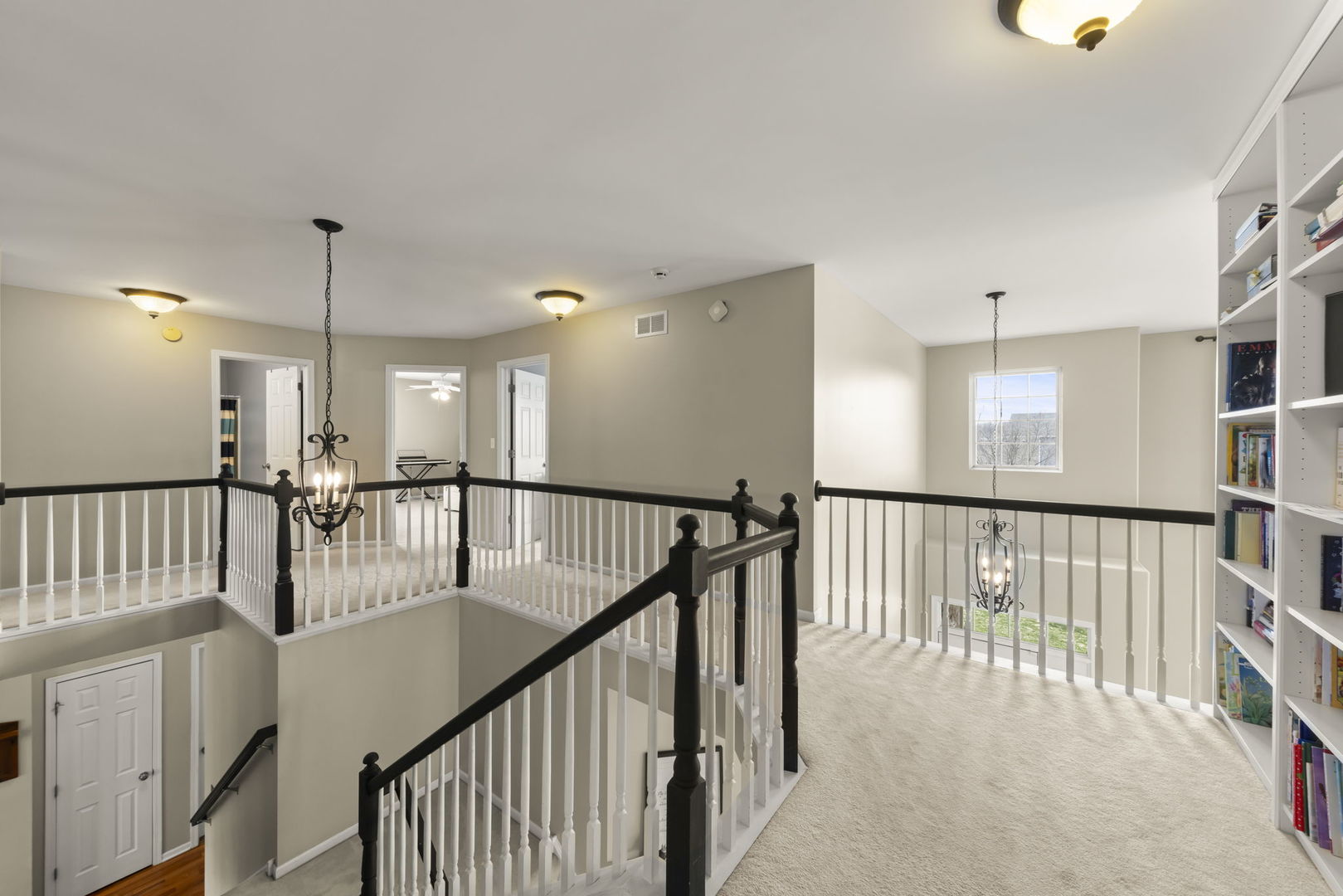 1934 Raintree Road Yorkville, IL 60560 - Photo 15 of 40 a view of staircase with lots of frames on wall and wooden floor