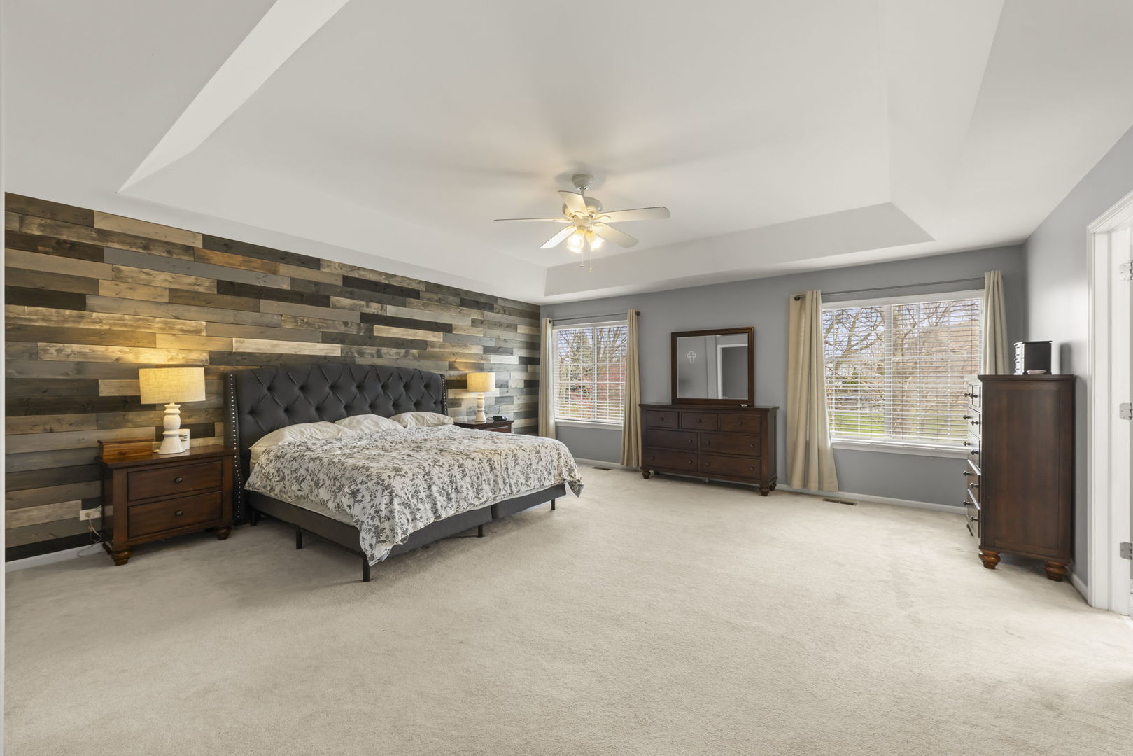 1934 Raintree Road Yorkville, IL 60560 - Photo 17 of 40 a bedroom with a large bed a flat tv screen and dresser