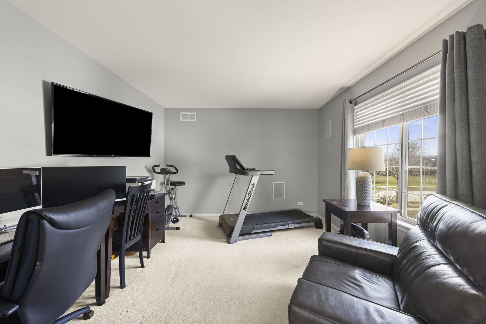 1934 Raintree Road Yorkville, IL 60560 - Photo 19 of 40 a living room with furniture and a flat screen tv