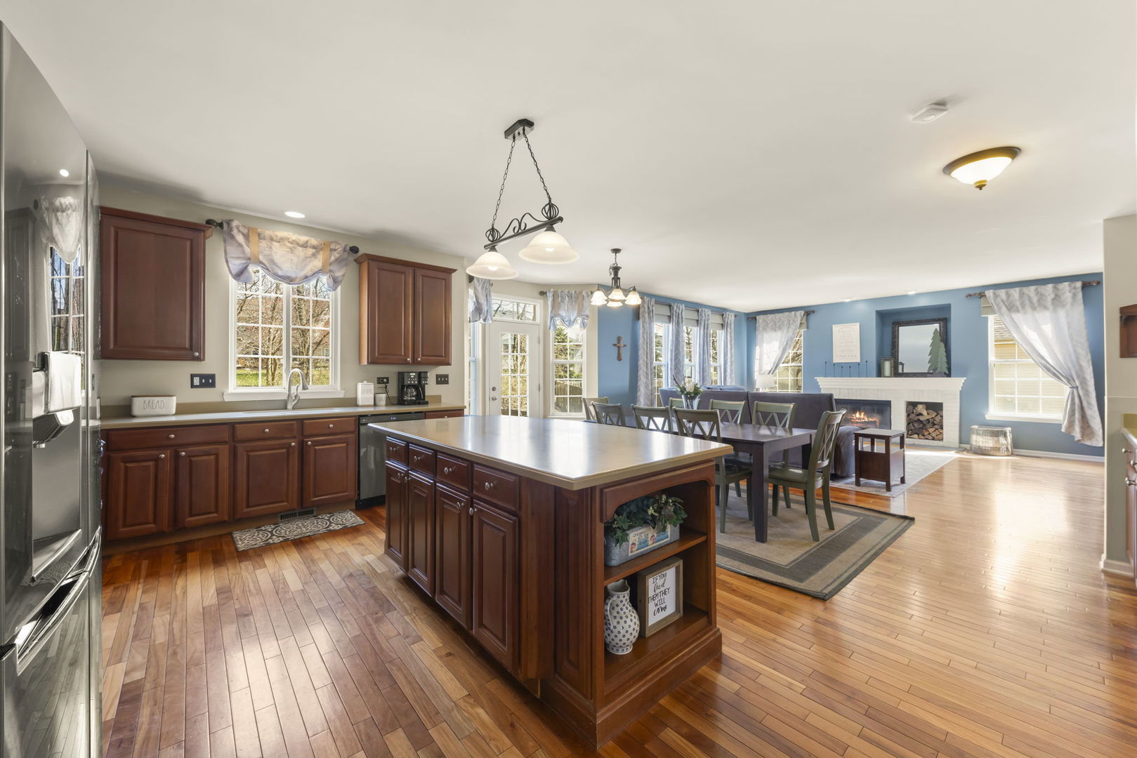 1934 Raintree Road Yorkville, IL 60560 - Photo 6 of 40 a kitchen with stainless steel appliances granite countertop a stove and a wooden floors