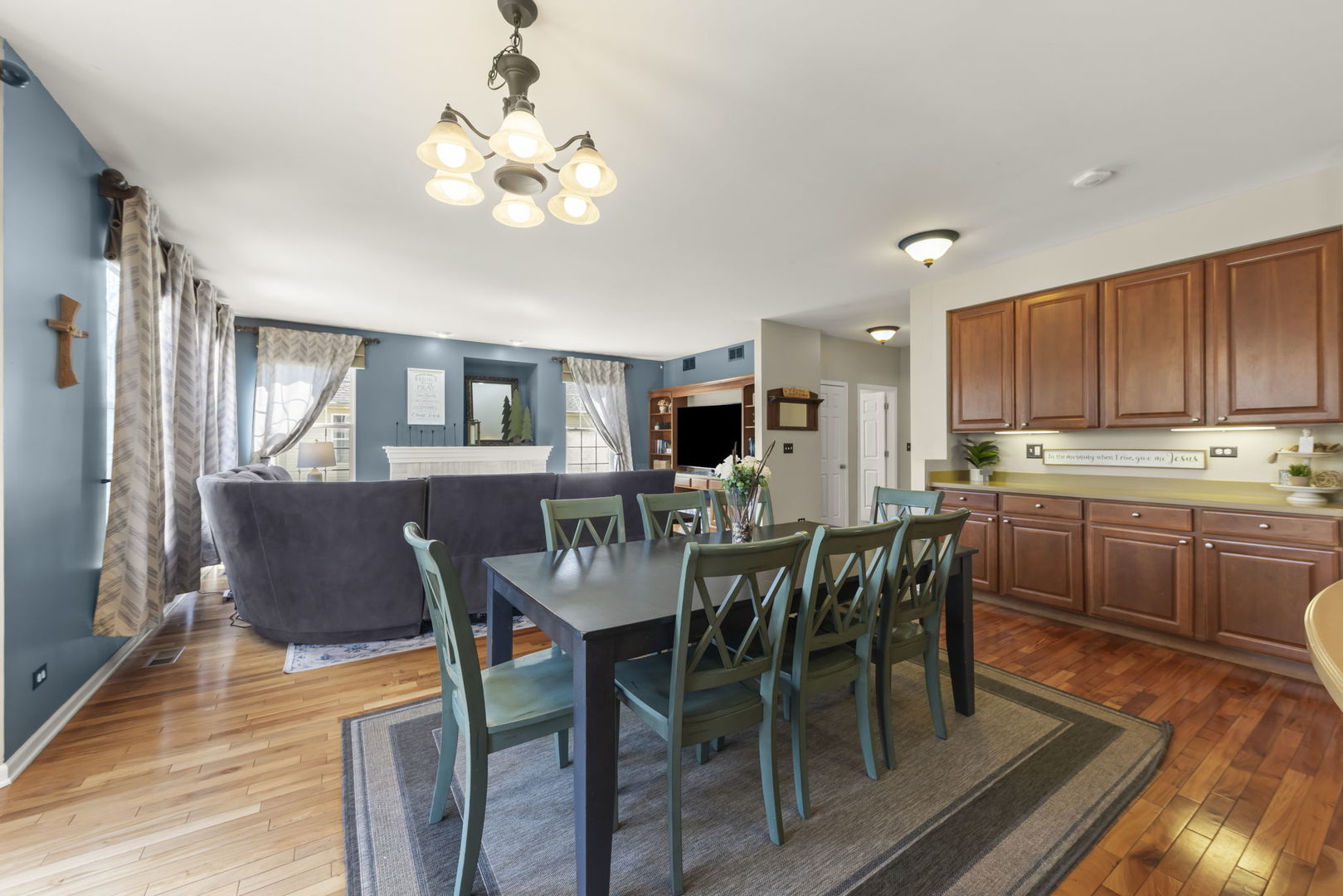 1934 Raintree Road Yorkville, IL 60560 - Photo 9 of 40 a view of a dining room with furniture a rug and wooden floor