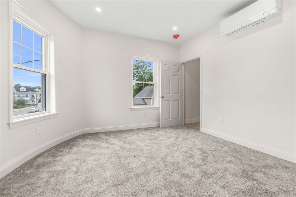1280 Middlesex Street Lowell, MA 01851 - Photo 20 of 35 an empty room with windows