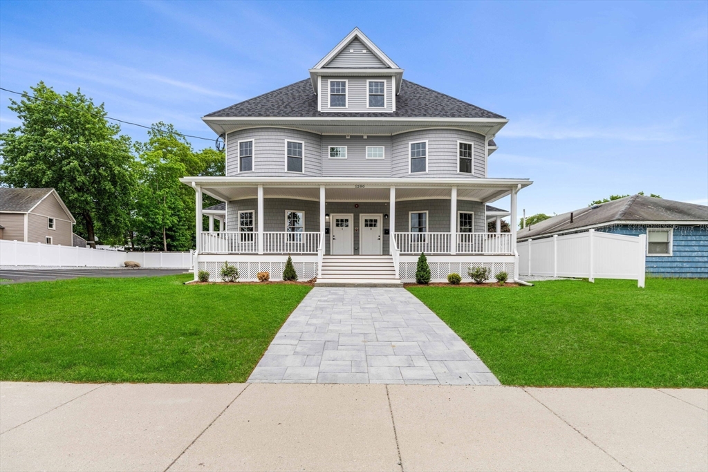 1280 Middlesex Street Lowell, MA 01851 - Photo 2 of 35 front view of a house with a yard