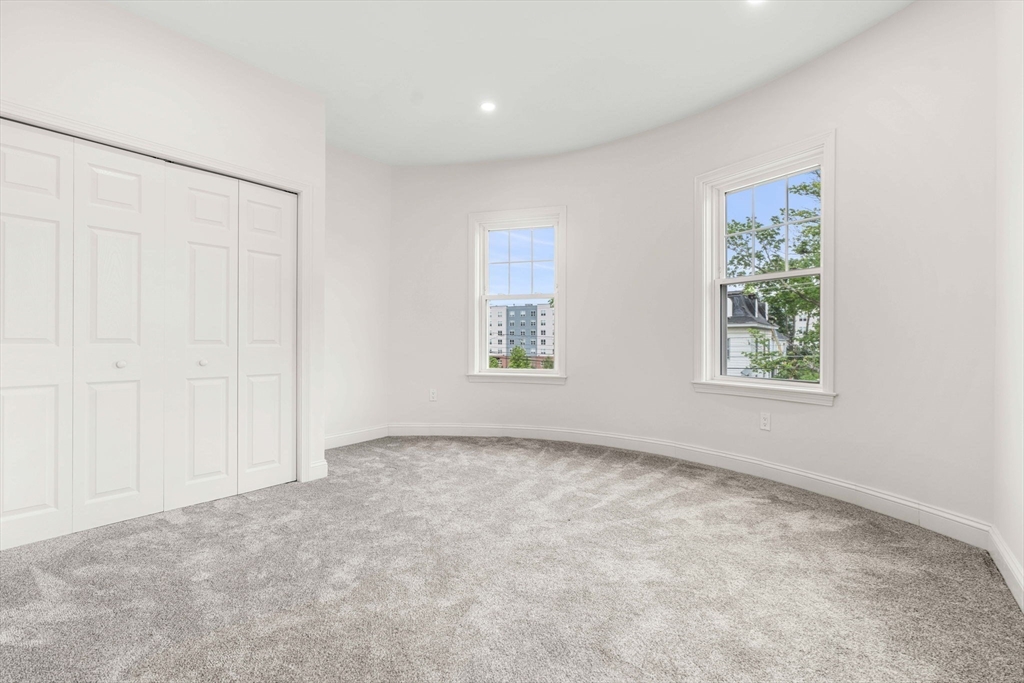 1280 Middlesex Street Lowell, MA 01851 - Photo 21 of 35 an empty room with windows