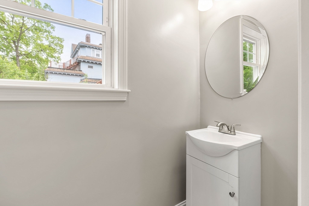 1280 Middlesex Street Lowell, MA 01851 - Photo 24 of 35 a bathroom with a sink and a mirror