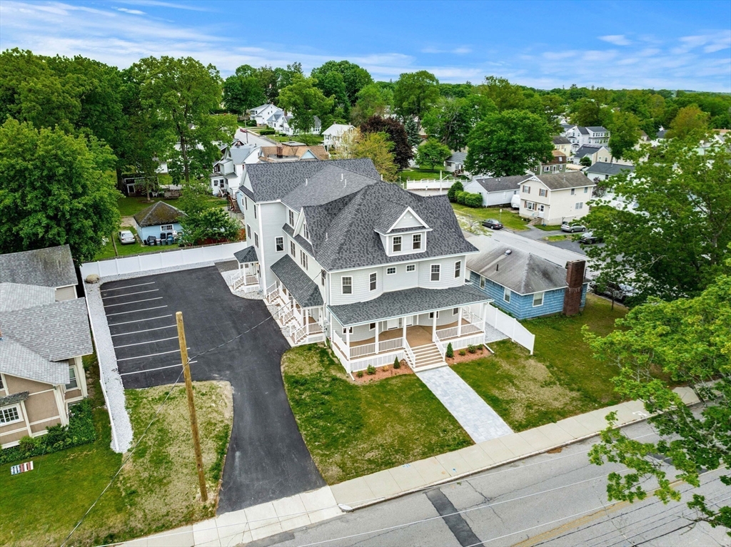 1280 Middlesex Street Lowell, MA 01851 - Photo 32 of 35 an aerial view of a house with garden space and street view