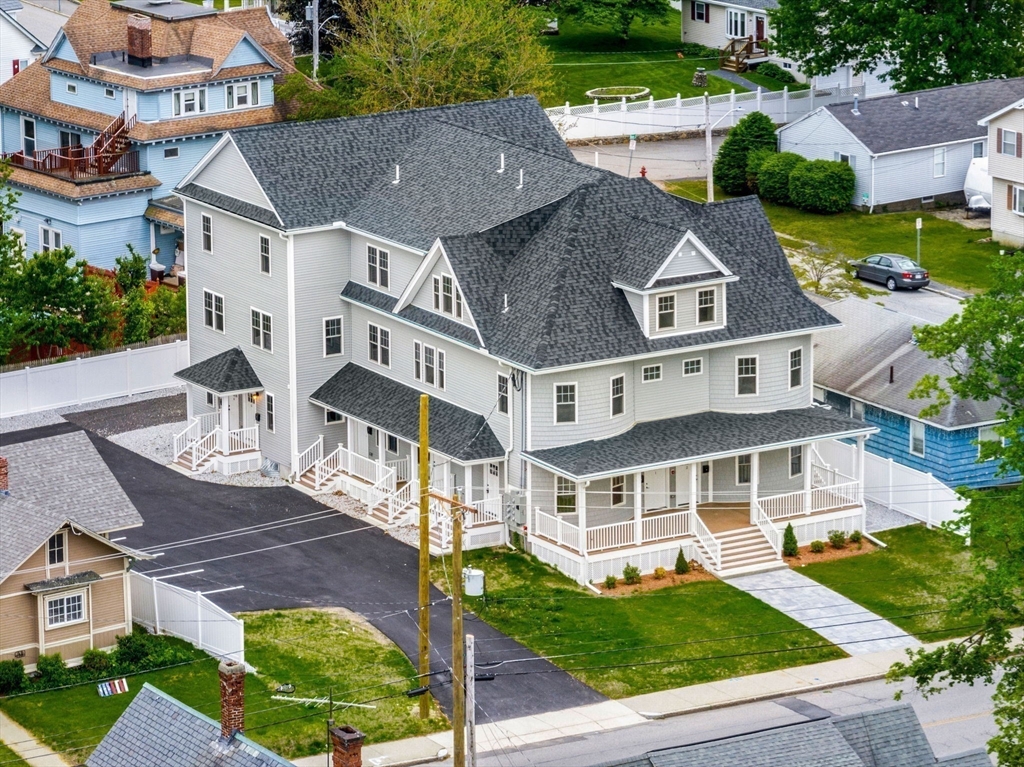 1280 Middlesex Street Lowell, MA 01851 - Photo 33 of 35 an aerial view of a house with a yard table and chairs