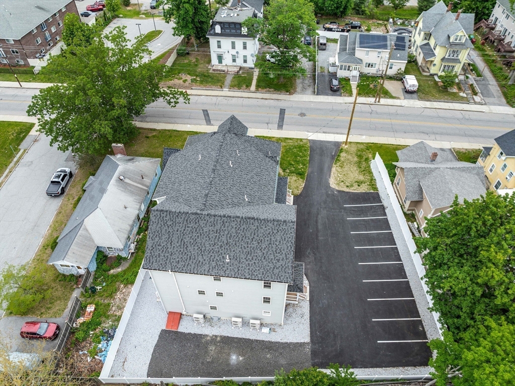 1280 Middlesex Street Lowell, MA 01851 - Photo 34 of 35 an aerial view of a house with a yard