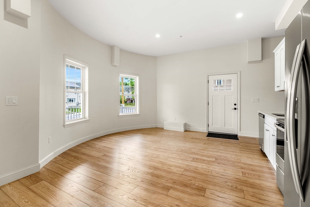1280 Middlesex Street Lowell, MA 01851 - Photo 8 of 35 wooden floor in an empty room with a window