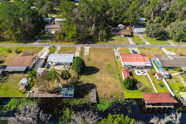 an aerial view of a house with a swimming pool