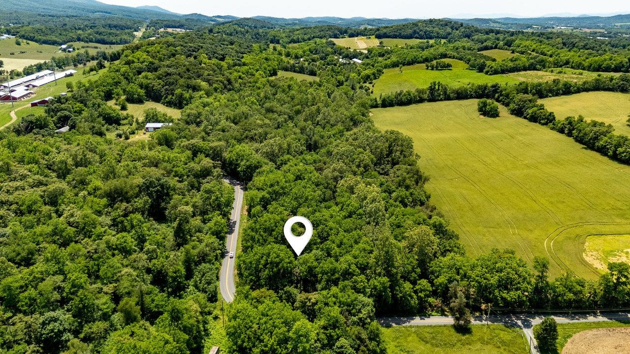 2410 Mauzy Athlone Road Harrisonburg, VA 22802 - Photo 5 of 28 a view of a garden with a building in the background