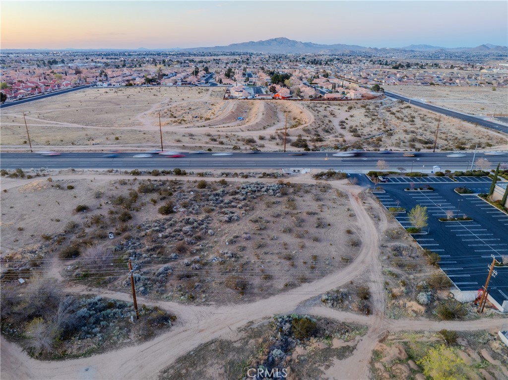 16401 Bear Valley Road Hesperia, CA 92345 - Photo 2 of 8 a view of a dry yard