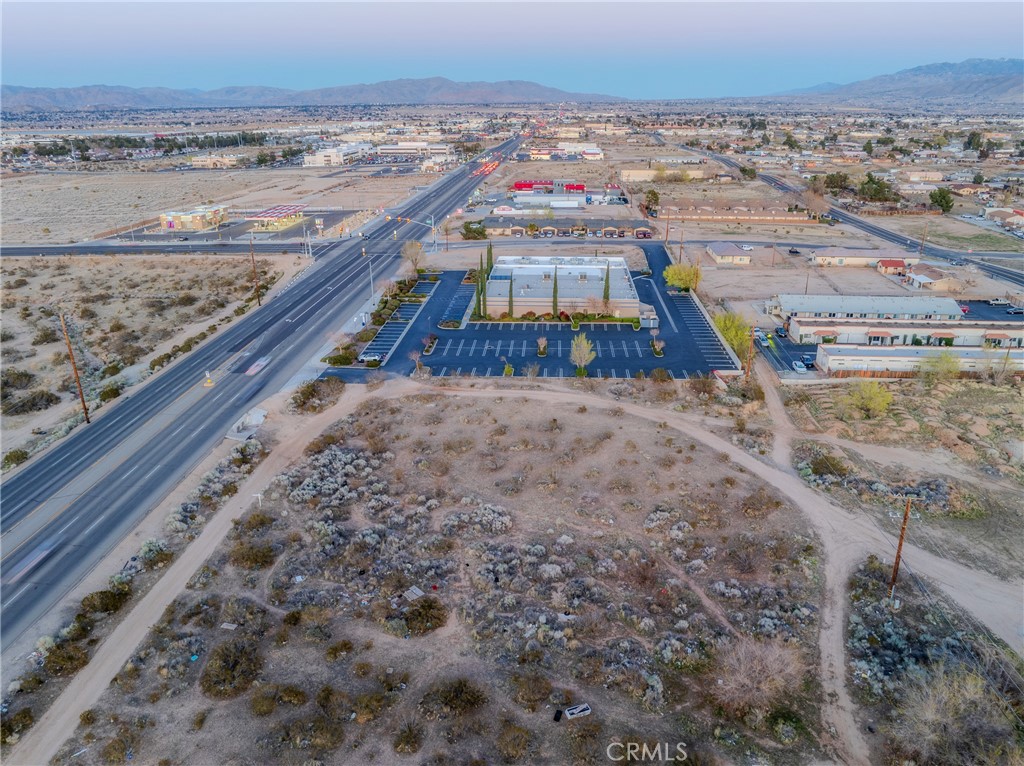 16401 Bear Valley Road Hesperia, CA 92345 - Photo 3 of 8 a city view with tall buildings