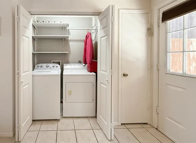 a view of a storage & utility room with washer and dryer