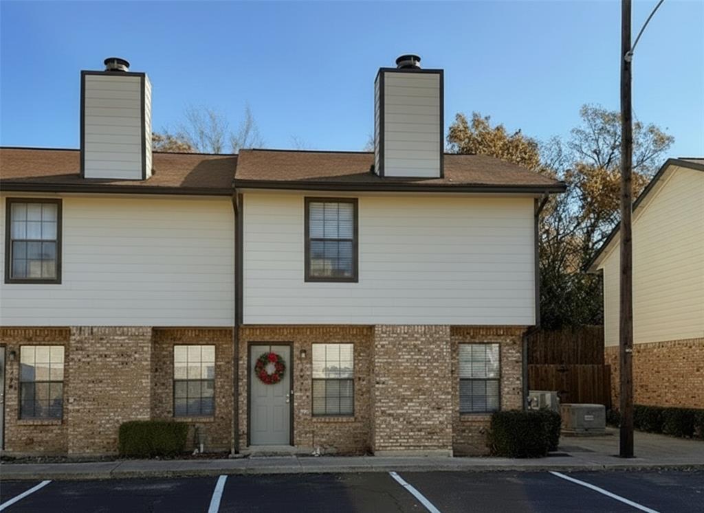 1237 Dallas Drive Denton, TX 76205 - Photo 13 of 18 a front view of a house with parking area
