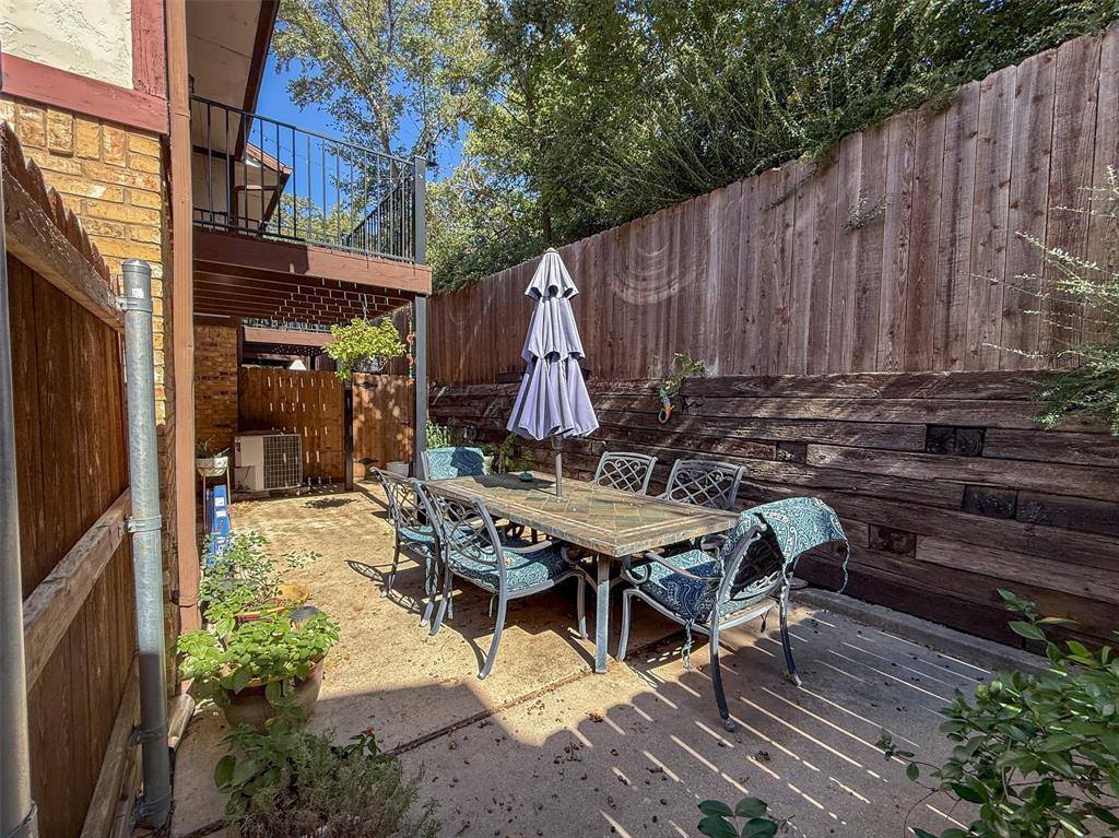 1237 Dallas Drive Denton, TX 76205 - Photo 16 of 18 a view of a dinning tables and chairs in the patio