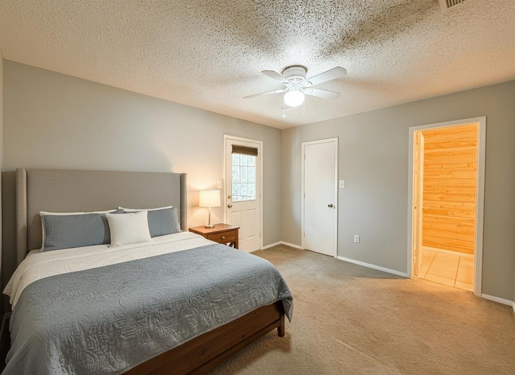 1237 Dallas Drive Denton, TX 76205 - Photo 10 of 18 a bedroom with a large bed and a window