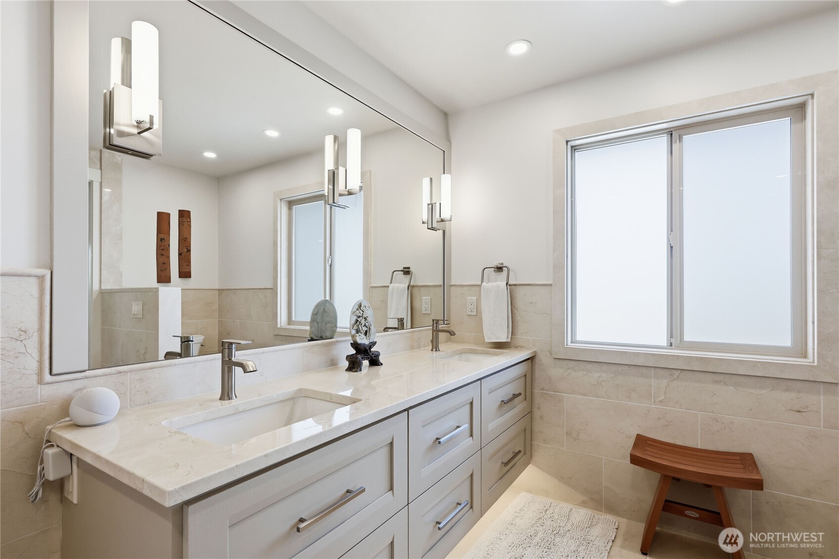 37709 Olympic View Road Northeast Hansville, WA 98340 - Photo 20 of 40 a bathroom with a sink double vanity and a mirror