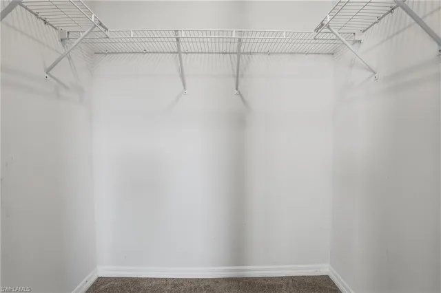 a bathroom with a double vanity sink toilet and shower