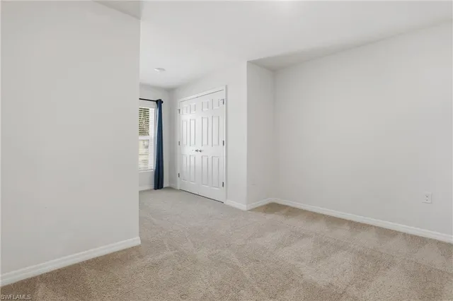 a bathroom with a sink a toilet a mirror and shower curtain