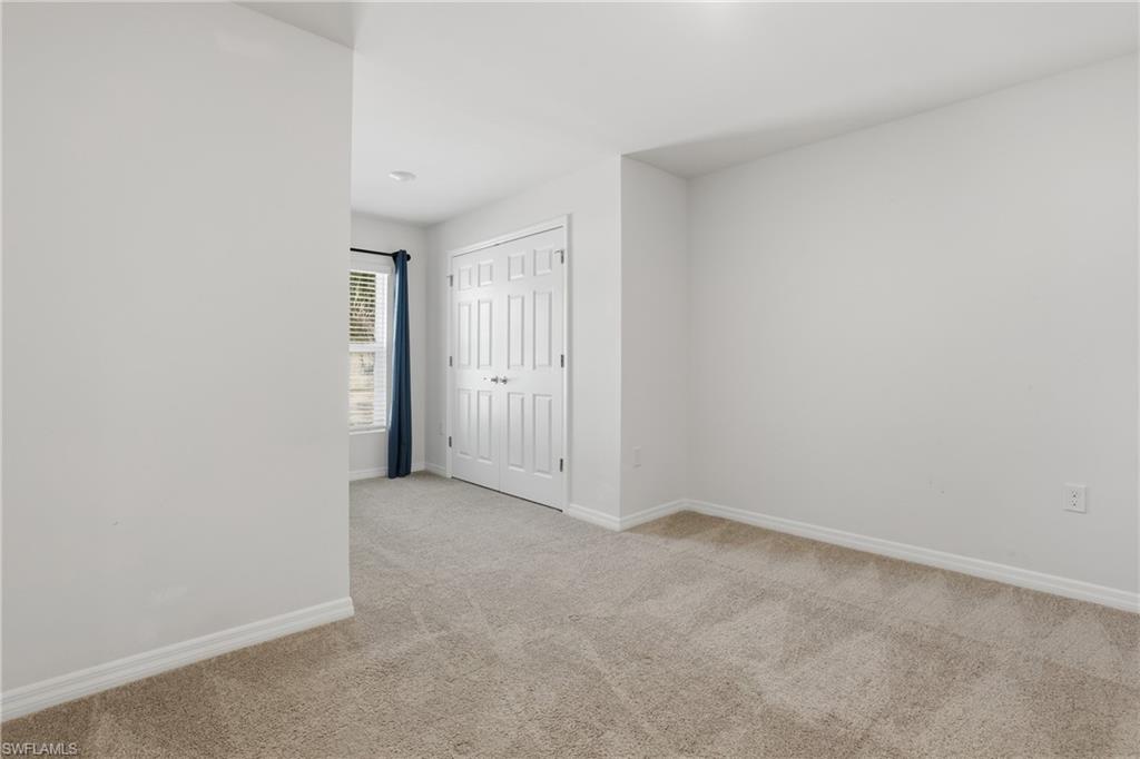 15368 Wildflower Circle Naples, FL 34119 - Photo 19 of 35 a view of an empty room