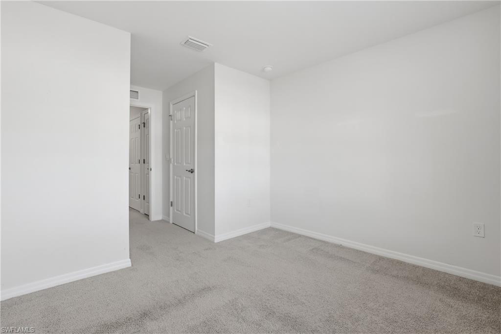 15368 Wildflower Circle Naples, FL 34119 - Photo 23 of 35 a view of an empty room