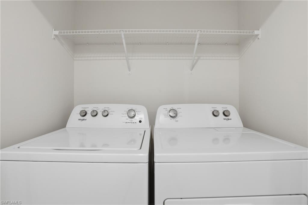 15368 Wildflower Circle Naples, FL 34119 - Photo 24 of 35 a utility room with dryer and washer