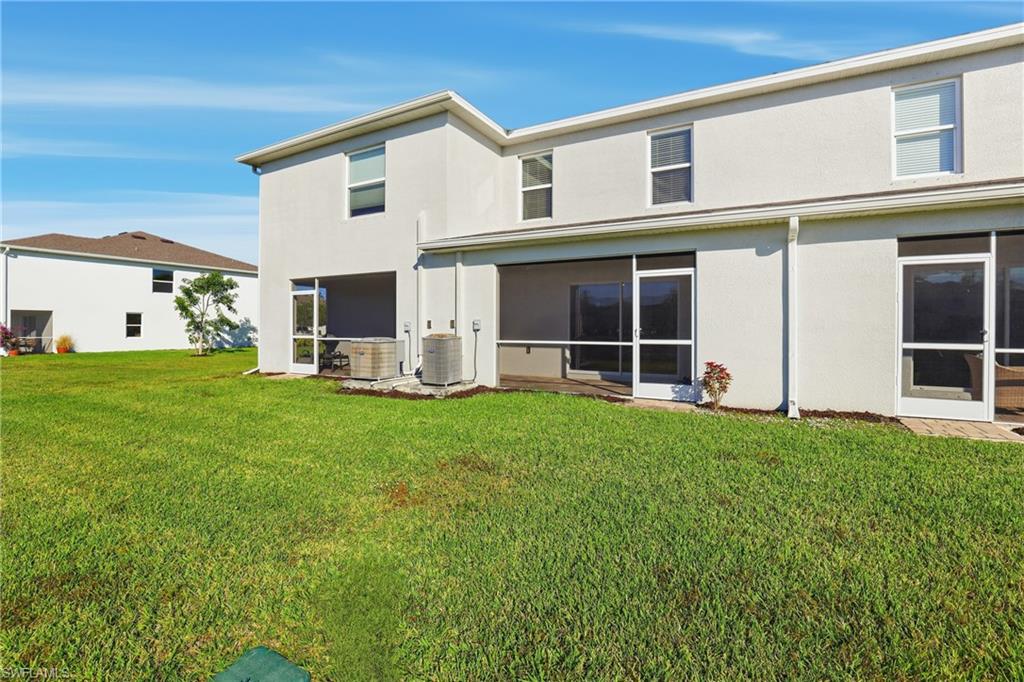 15368 Wildflower Circle Naples, FL 34119 - Photo 28 of 35 a view of a house with backyard