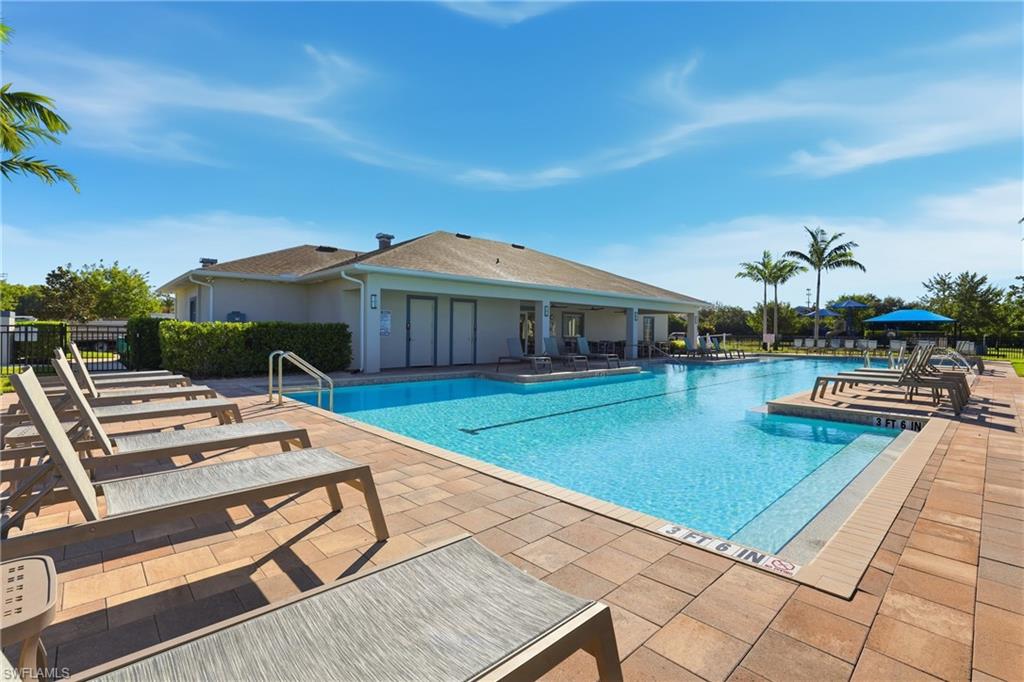 15368 Wildflower Circle Naples, FL 34119 - Photo 29 of 35 a view of a patio with chairs and potted plants