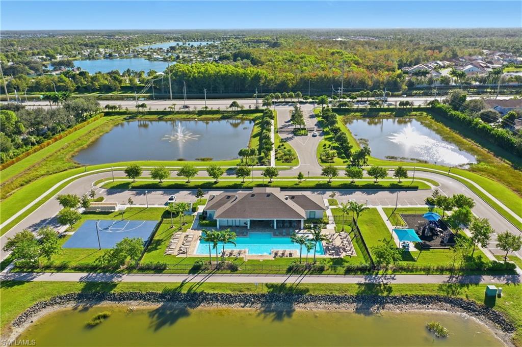 15368 Wildflower Circle Naples, FL 34119 - Photo 30 of 35 an aerial view of a house with a lake view