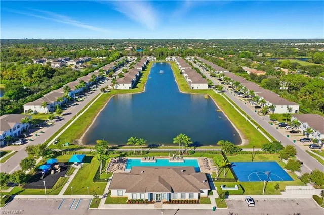 a room with pool table and windows