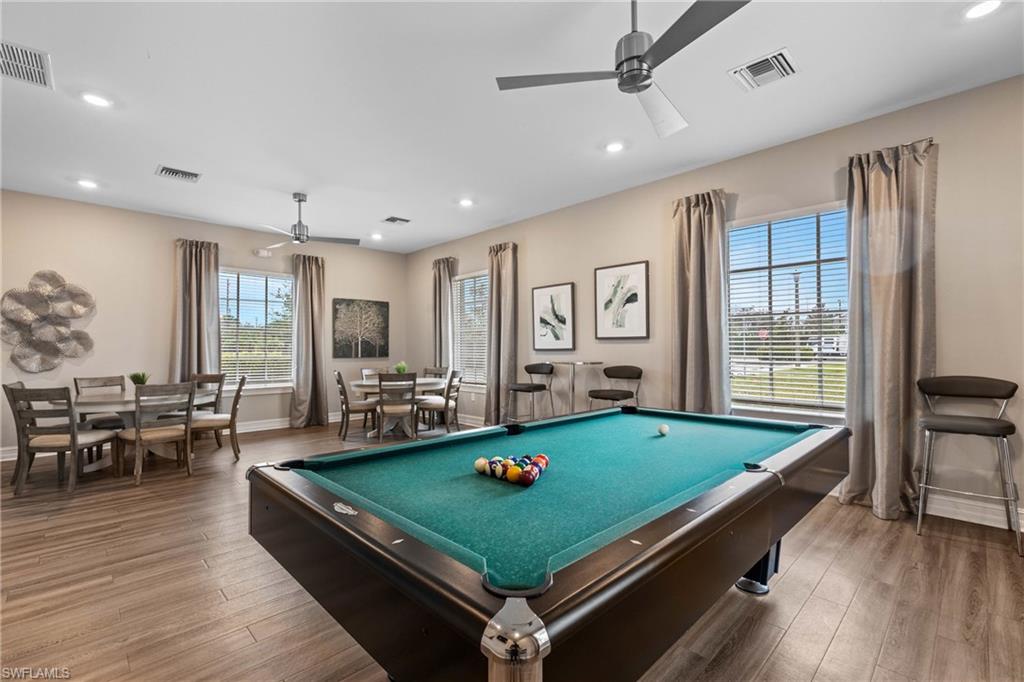 15368 Wildflower Circle Naples, FL 34119 - Photo 33 of 35 a room with pool table and windows