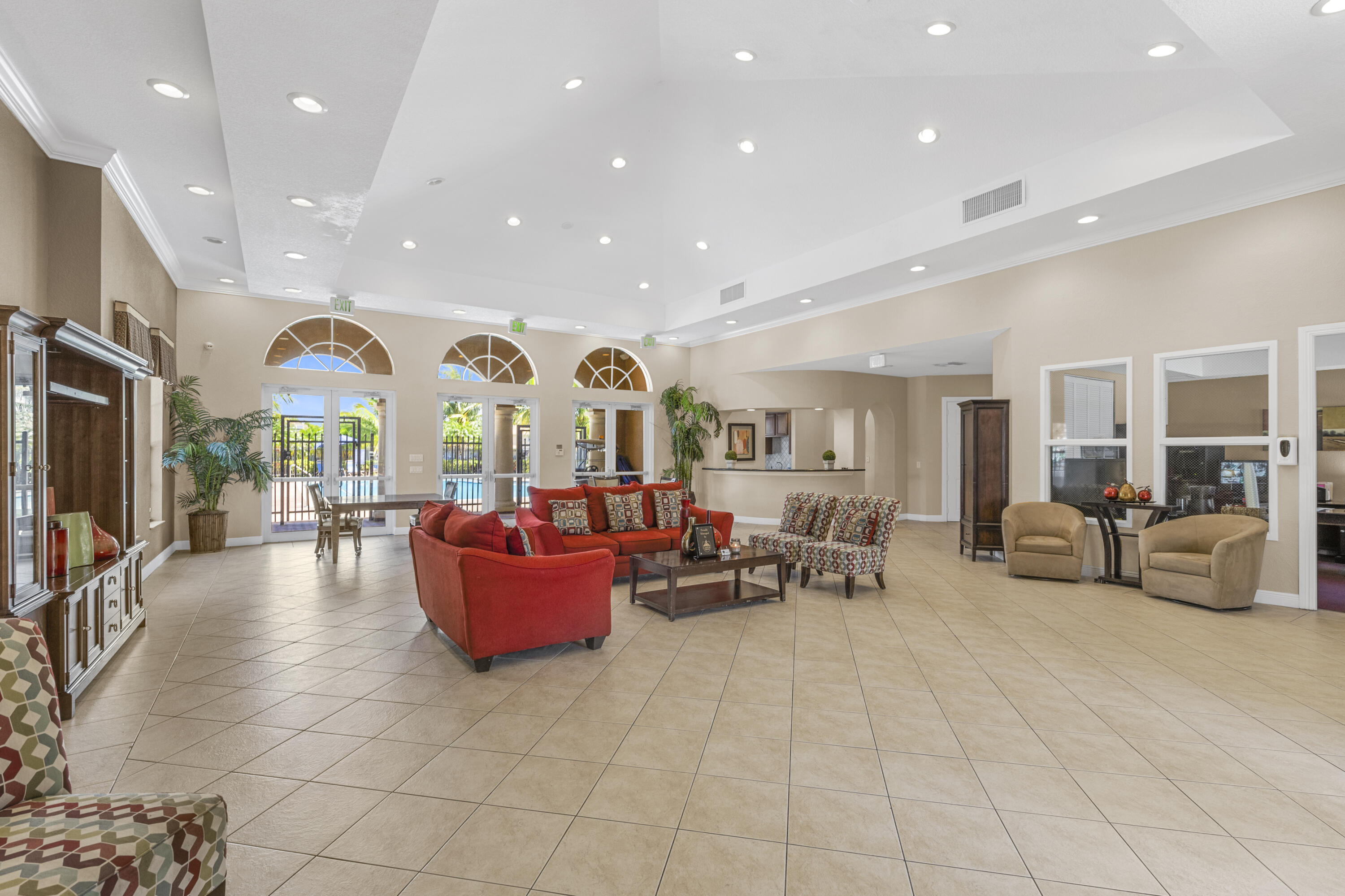9107 Chambers Street, Unit 9107 Tamarac, FL 33321 - Photo 25 of 30 a living room with fireplace furniture and a large window
