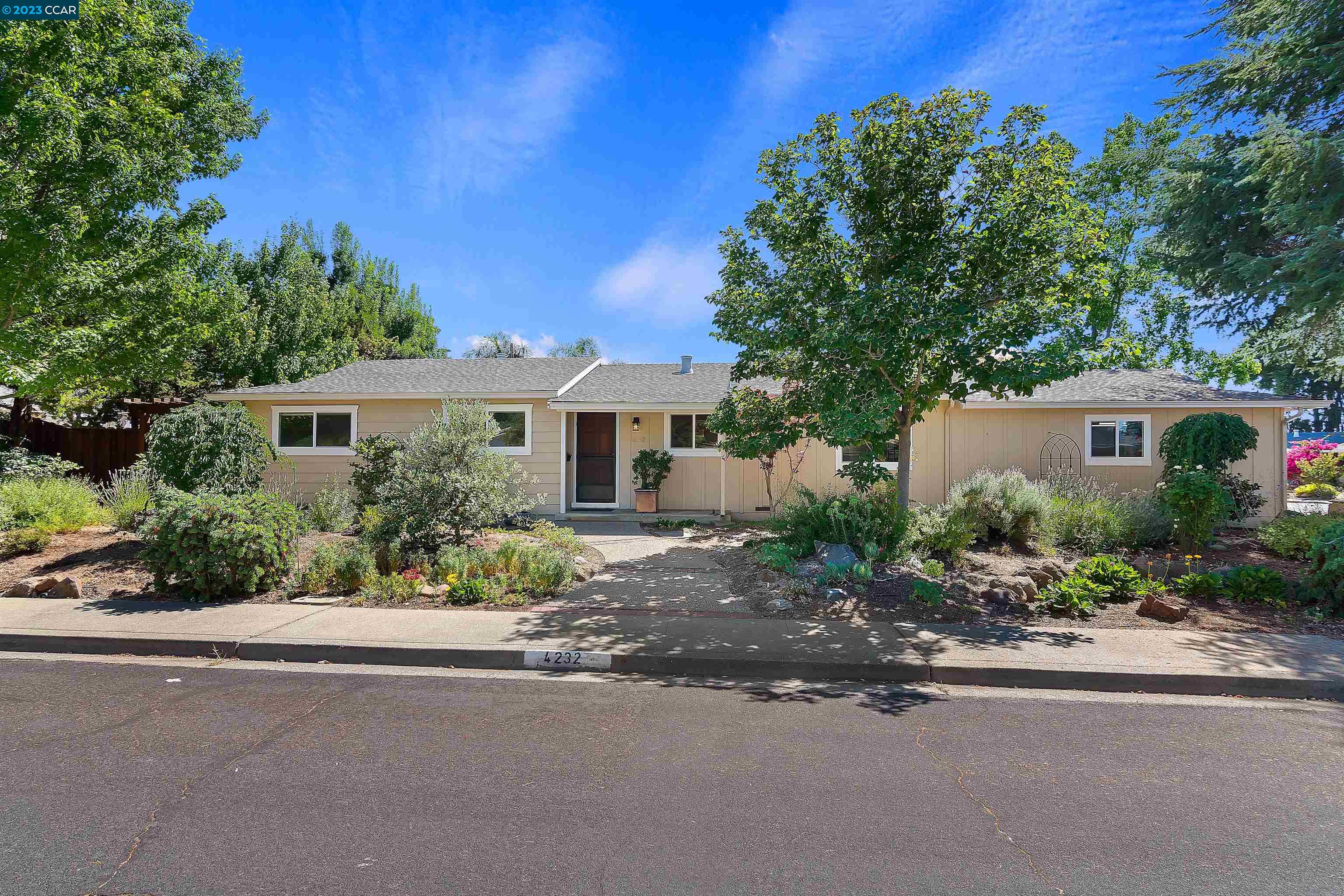 4232 Woodland Drive Concord, CA 94521 - Photo 1 of 1 front view of a house with a street