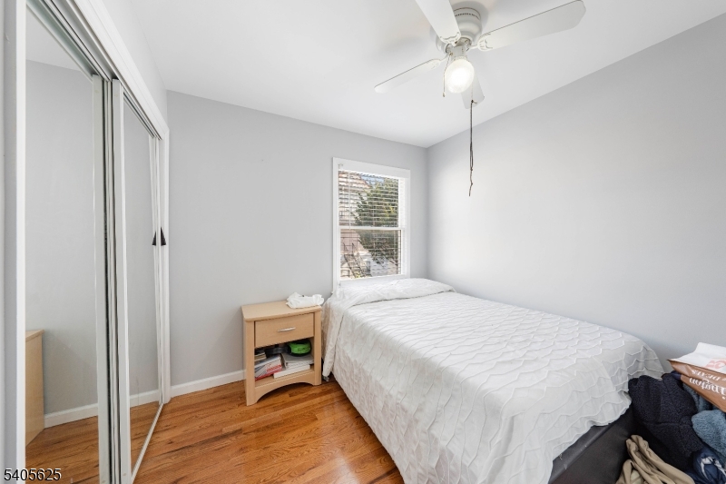 118 Race Street, Unit 2 Elizabeth, NJ 07202 - Photo 6 of 16 a bedroom with a bed and a window