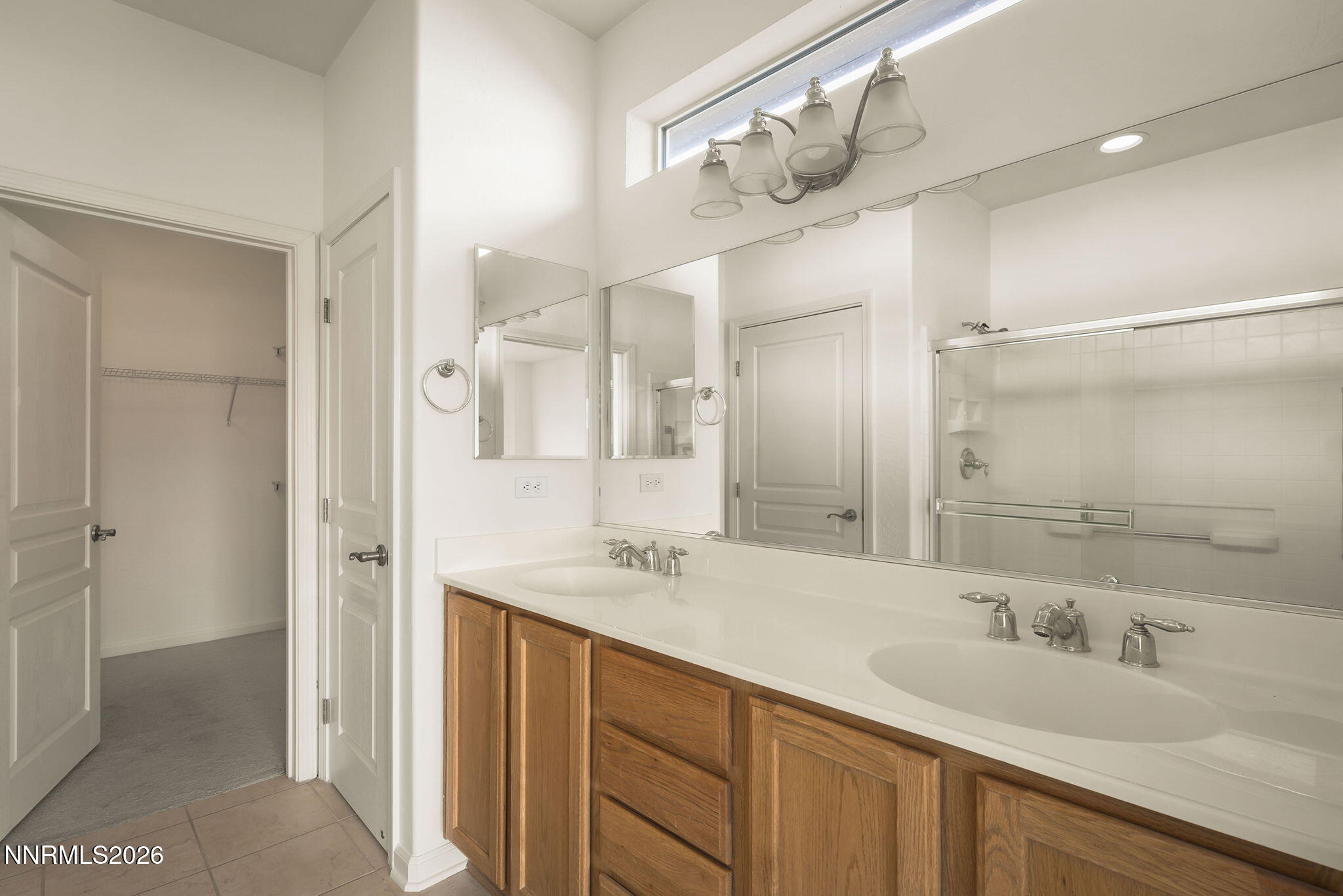 1710 Autumn Valley Way Reno, NV 89523 - Photo 17 of 25 a bathroom with a double vanity sink mirror and shower