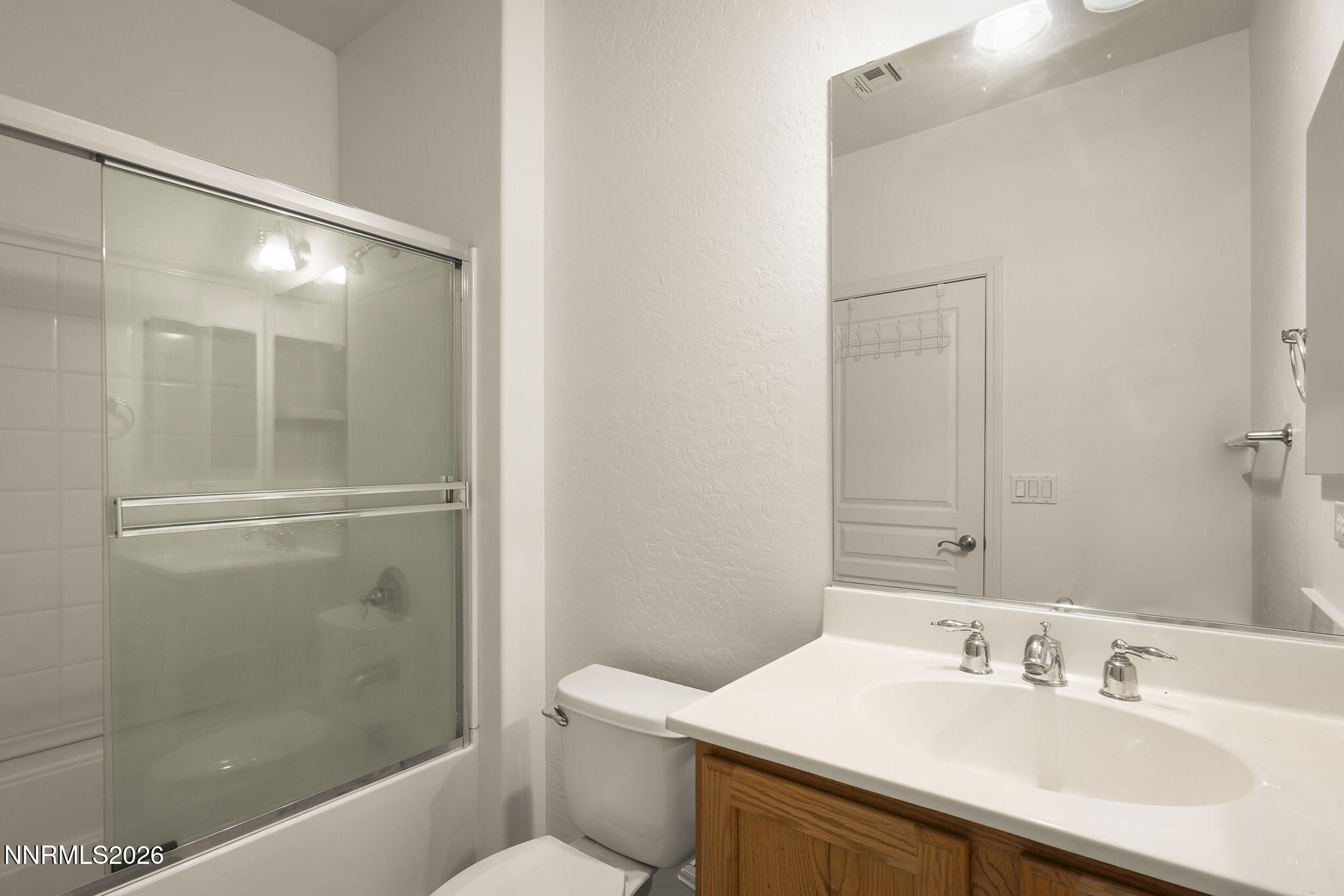 1710 Autumn Valley Way Reno, NV 89523 - Photo 20 of 25 a bathroom with a sink a toilet and shower