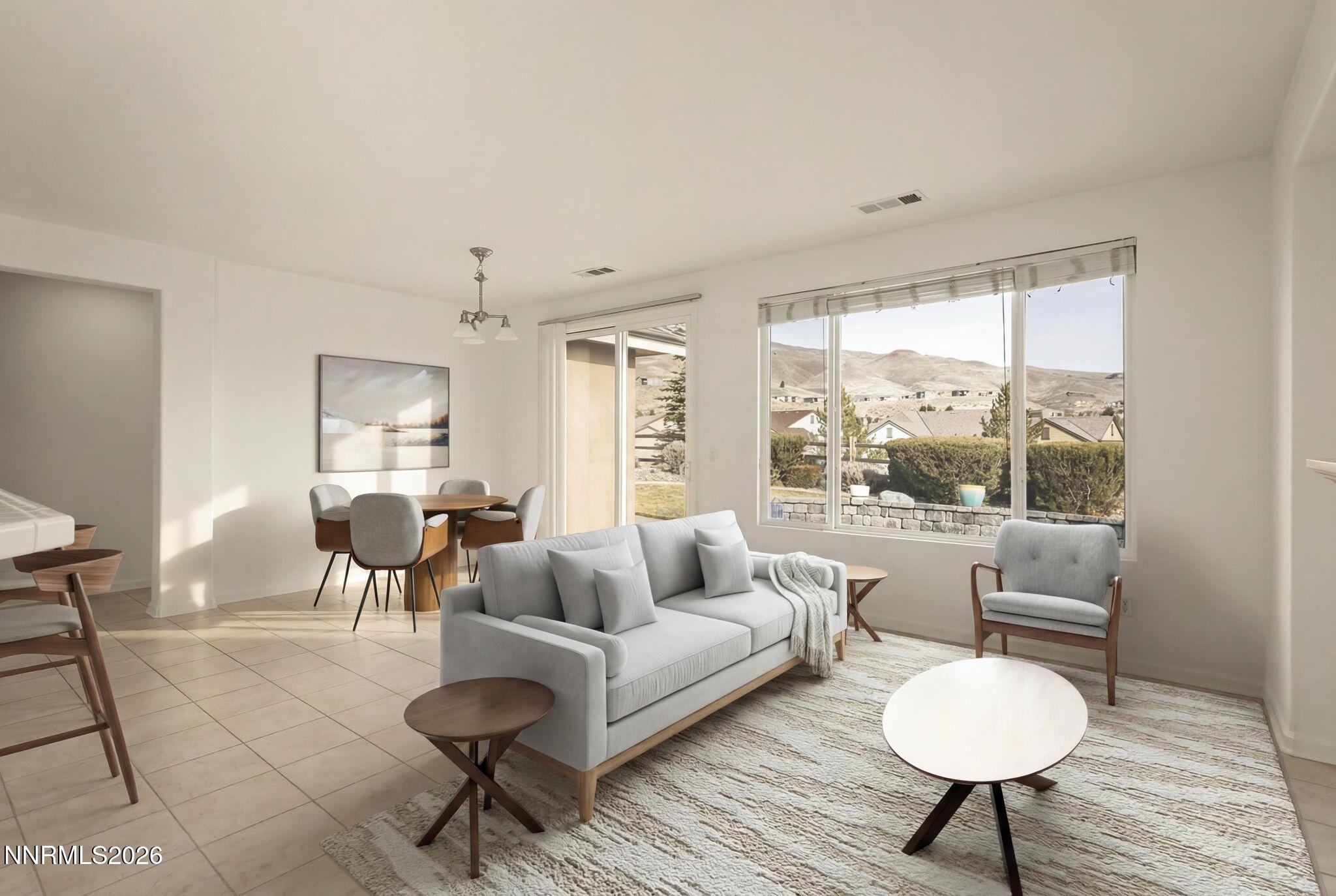 1710 Autumn Valley Way Reno, NV 89523 - Photo 2 of 25 a living room with furniture and a large window