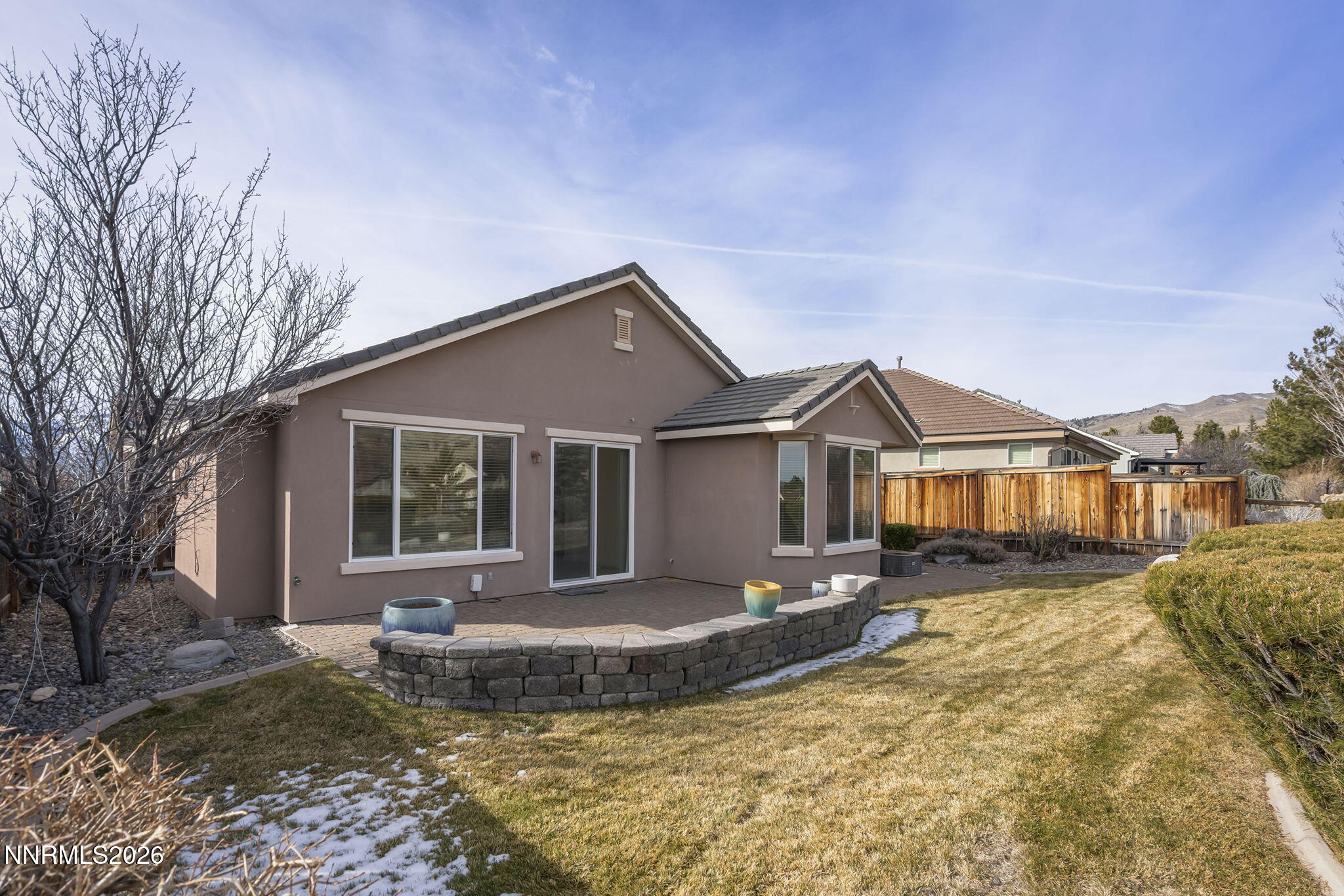 1710 Autumn Valley Way Reno, NV 89523 - Photo 22 of 25 a front view of a house with a yard and potted plants