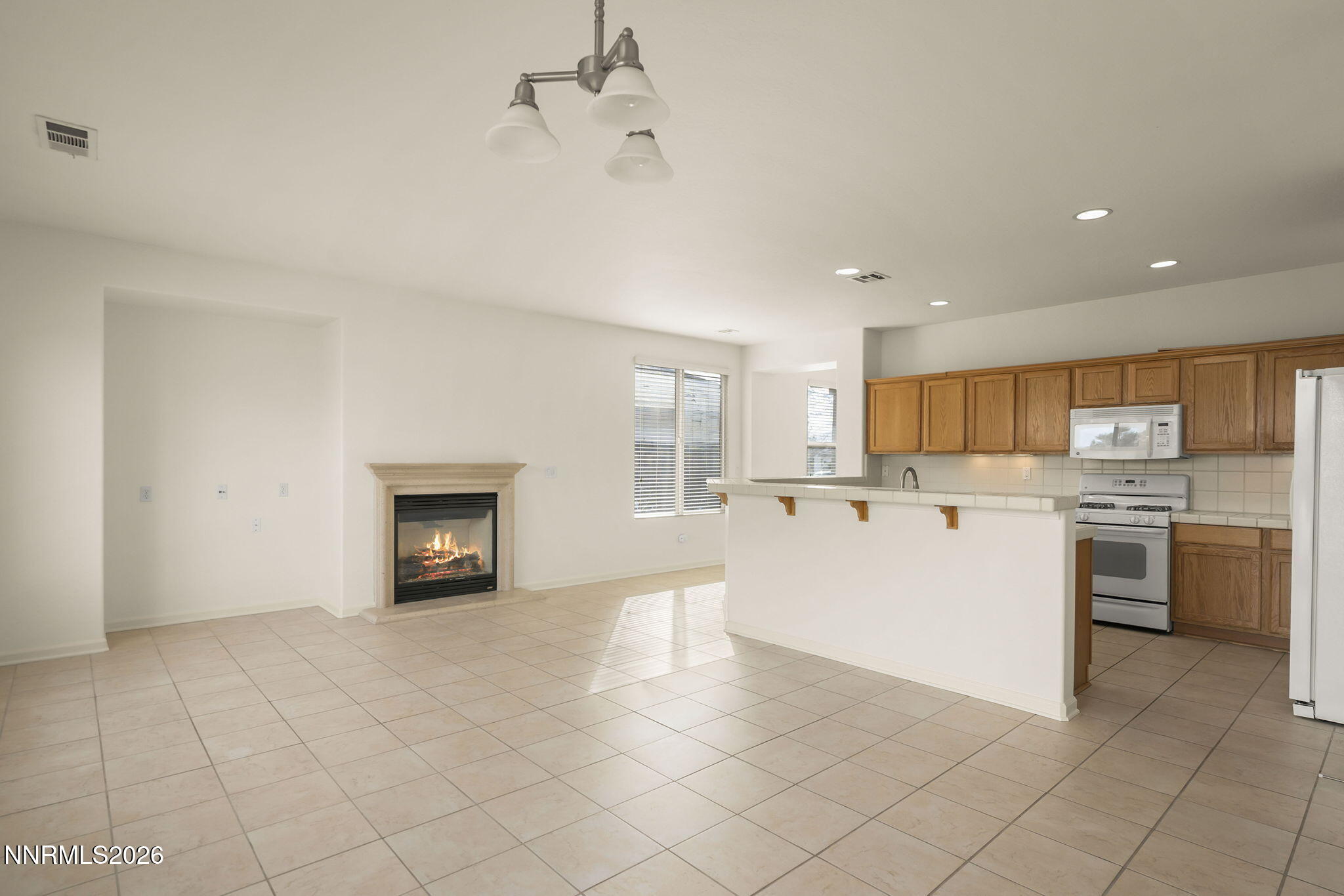 1710 Autumn Valley Way Reno, NV 89523 - Photo 5 of 25 a view of a kitchen with a sink stove and cabinets