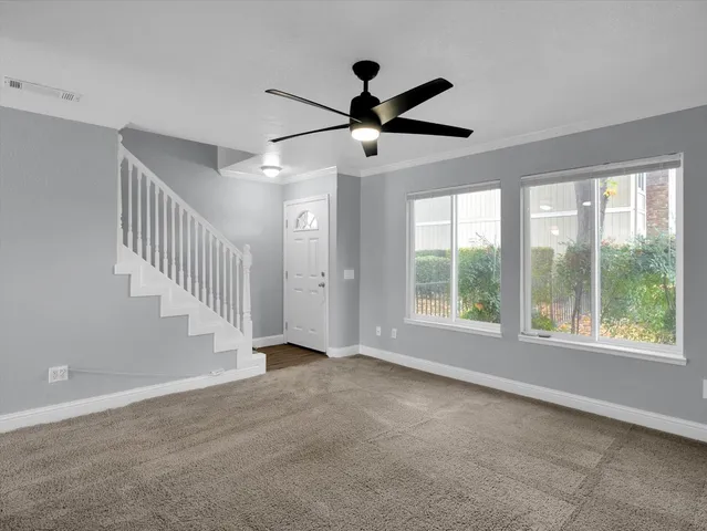 a view of an empty room with a window