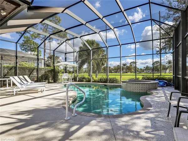 a view of a swimming pool with a patio