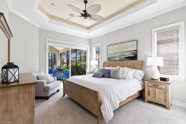 a bedroom with a bed couch and window