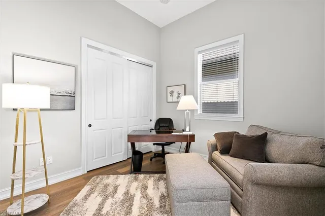 a living room with furniture and a window